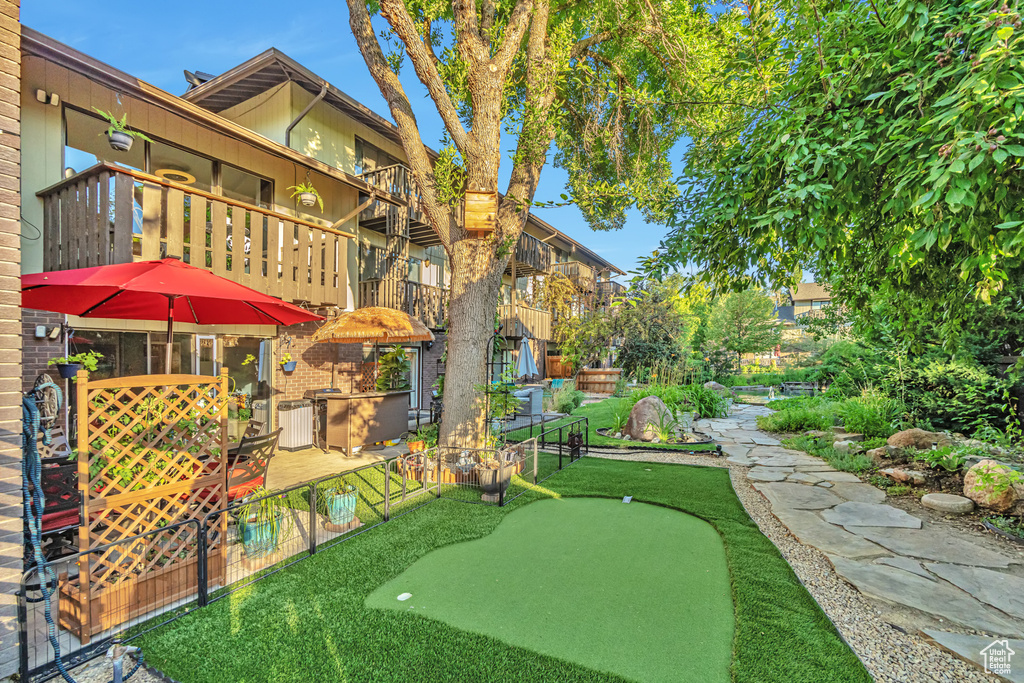 View of home\'s community with a putting green