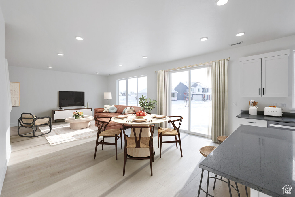 Dining room featuring light wood-style floors and recessed lighting