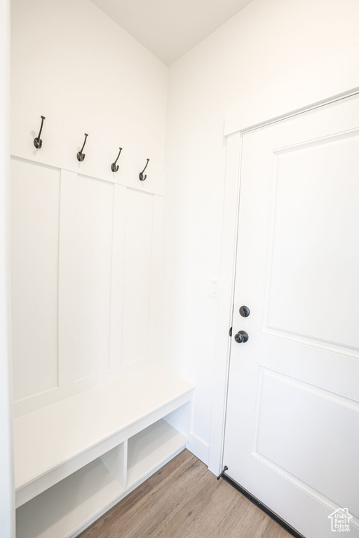 Mudroom featuring light wood-style floors