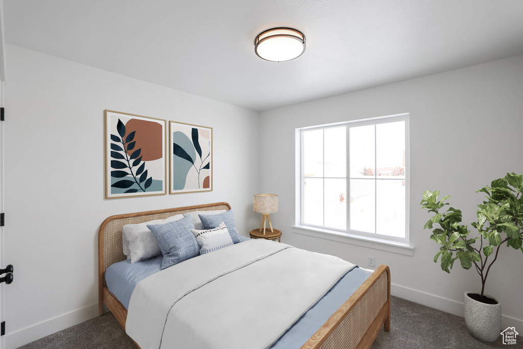 Bedroom with baseboards and carpet flooring