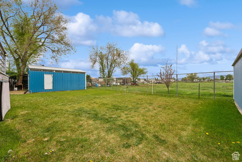 View of yard with an outbuilding and an outdoor structure