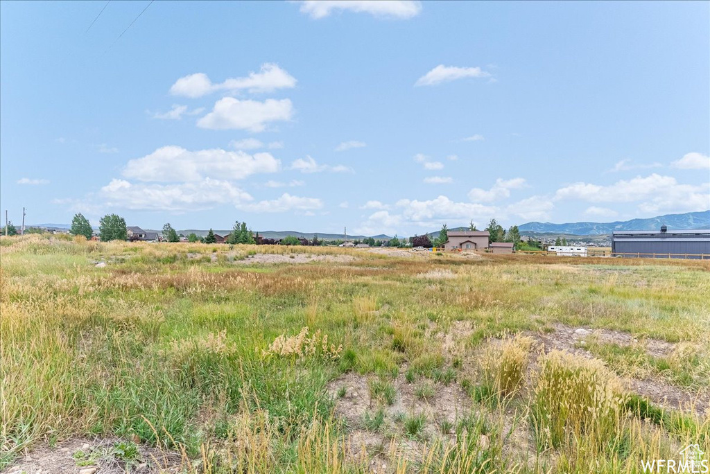View of yard featuring a mountain view and a view of countryside
