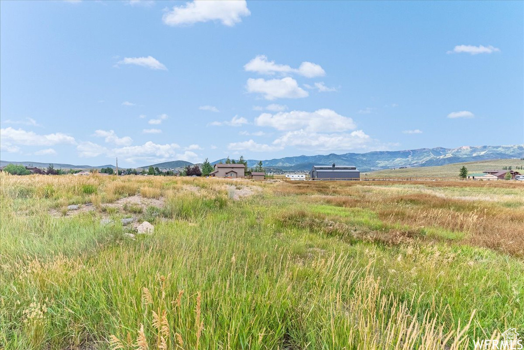 Water view featuring rural landscape and a mountain backdrop