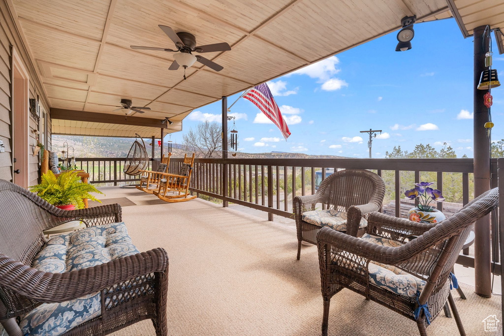 View of patio / terrace featuring a ceiling fan and a porch