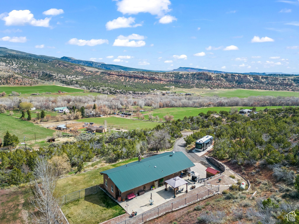 Aerial view of property and surrounding area with mountains