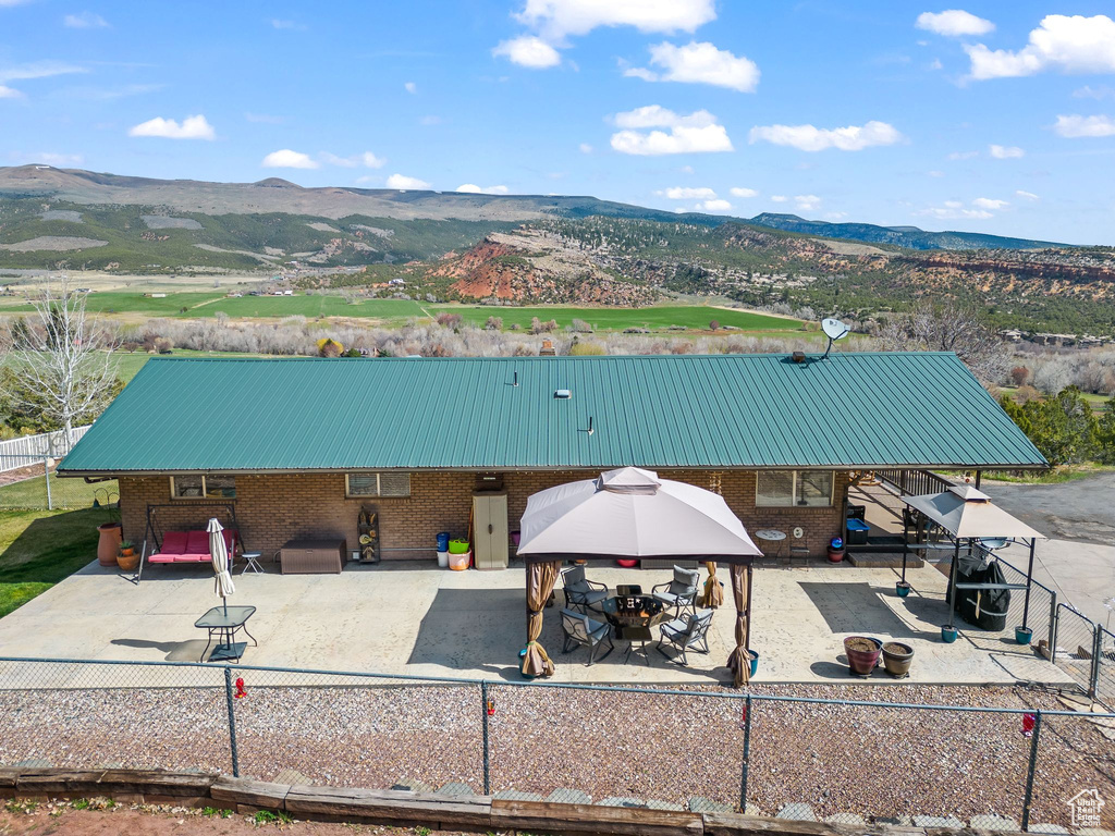 View of subject property featuring mountains