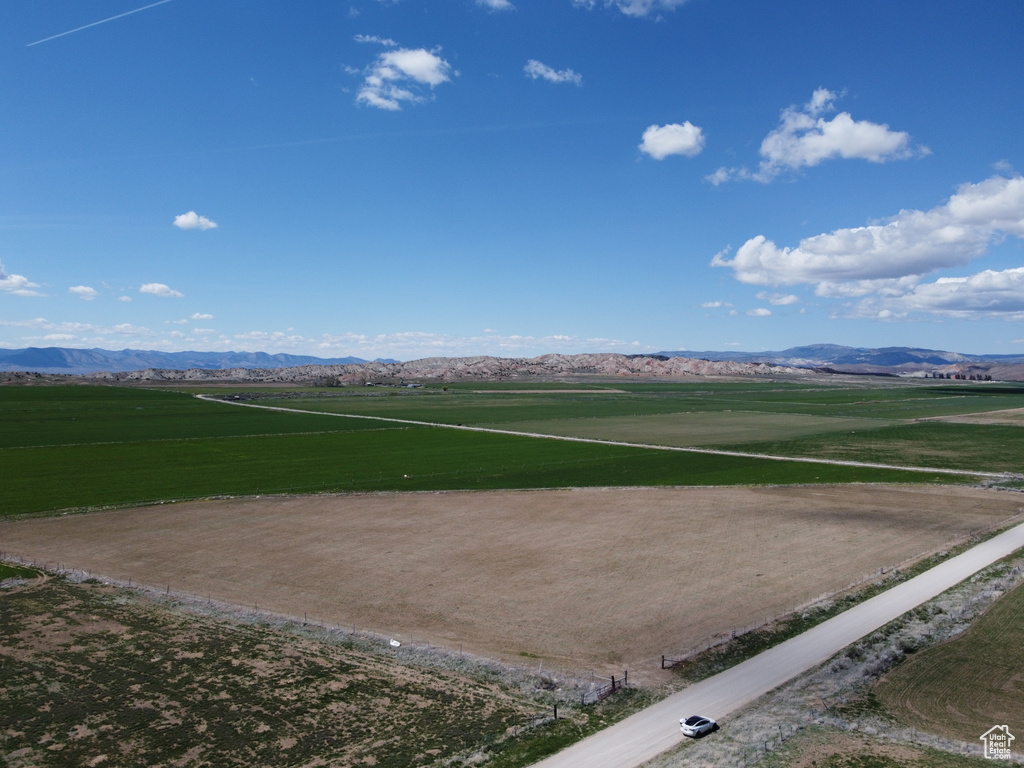 View of community with a rural view and a mountain view