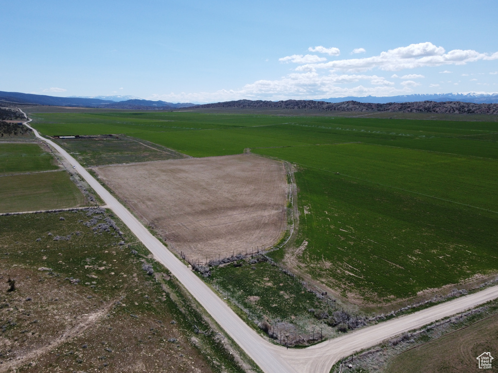 Birds eye view of property with a mountain view and a rural view