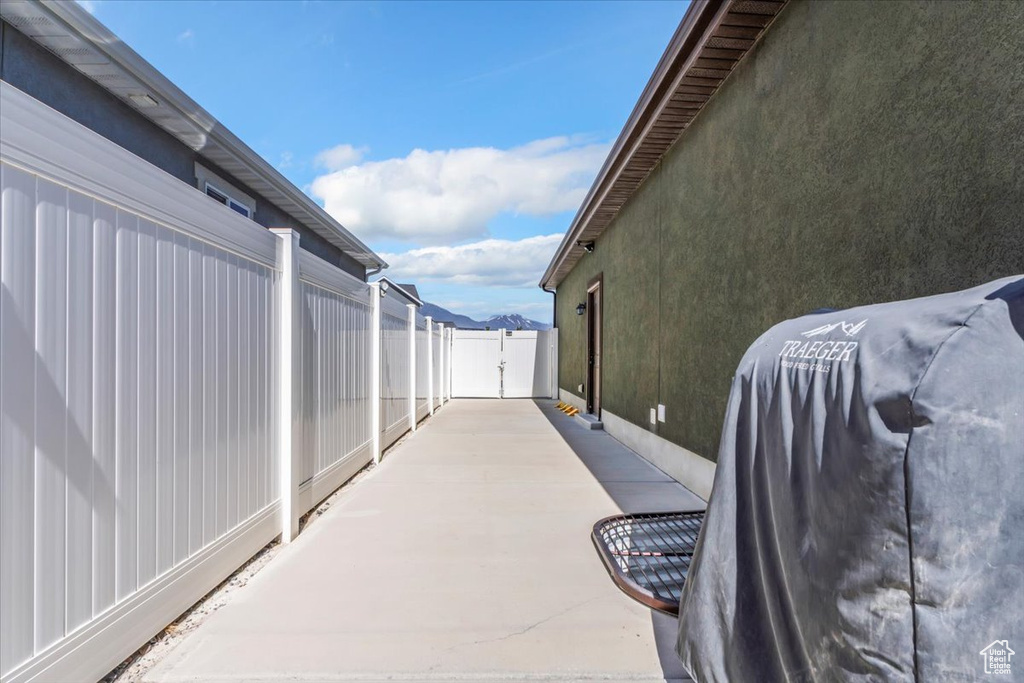 View of patio with fence