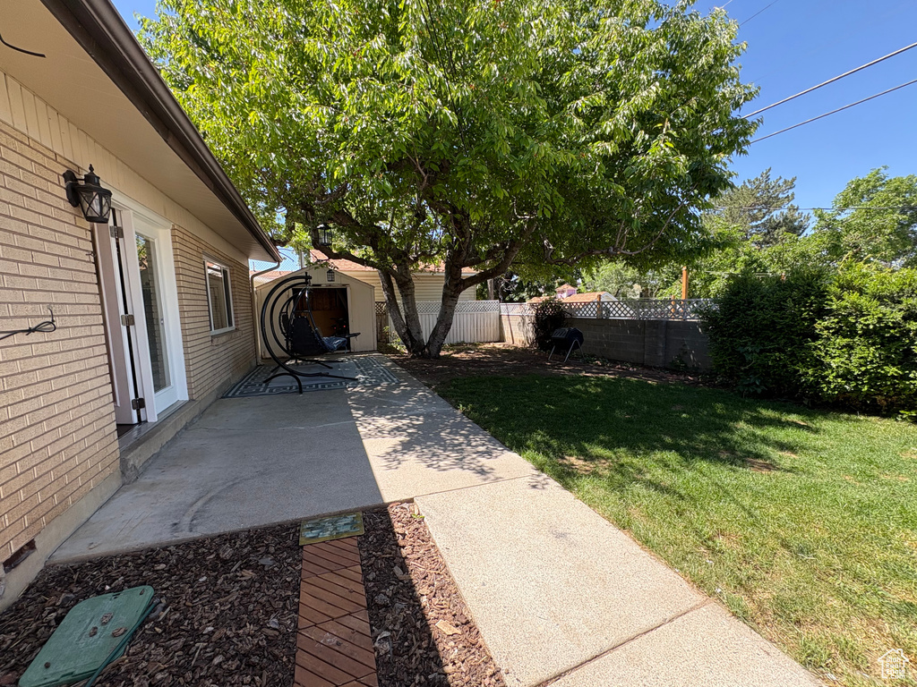 View of yard with a patio