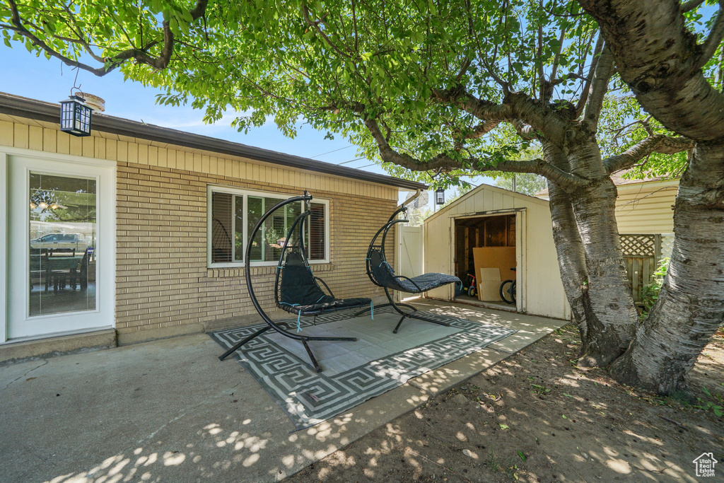 View of patio / terrace with a shed