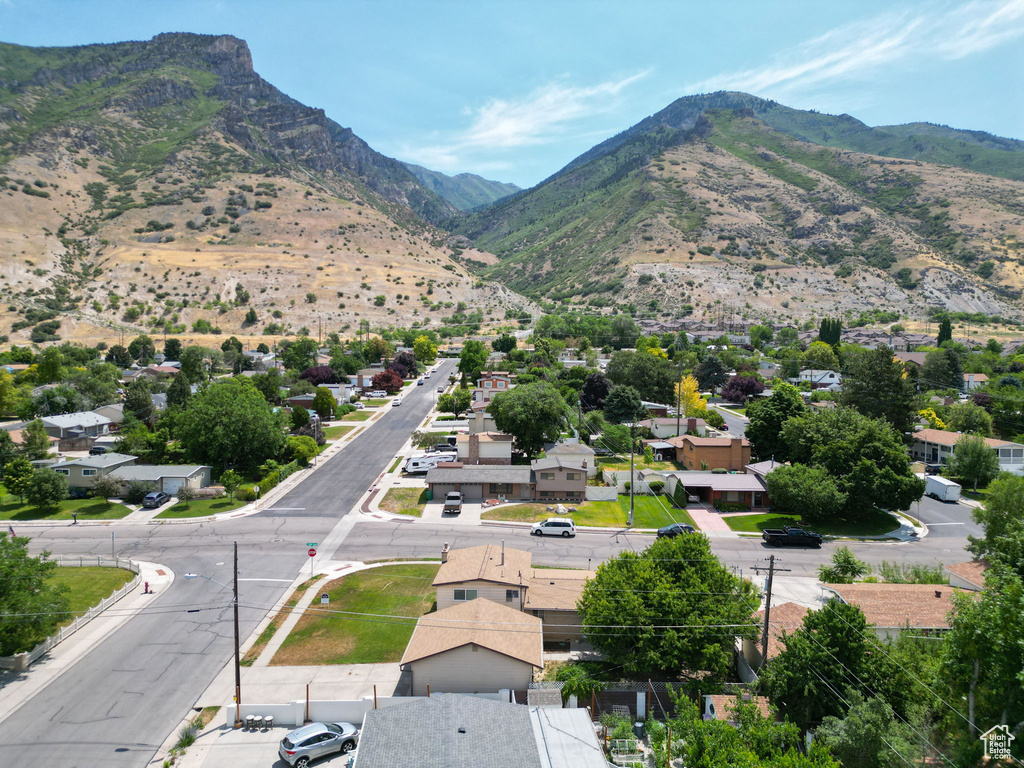 View of mountain backdrop featuring nearby suburban area