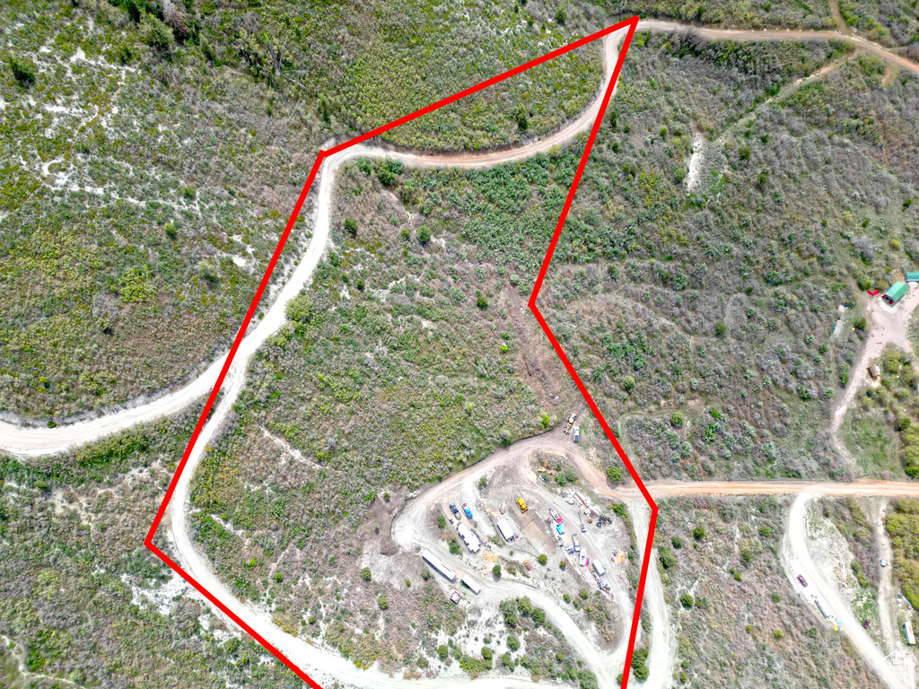 Aerial view of property and surrounding area with property boundaries highlighted