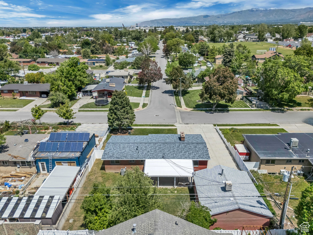 Aerial view of residential area featuring a mountainous background