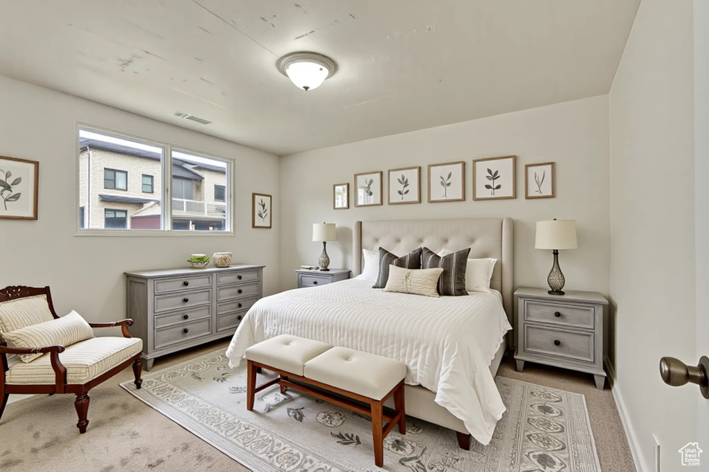 Bedroom featuring carpet floors and baseboards