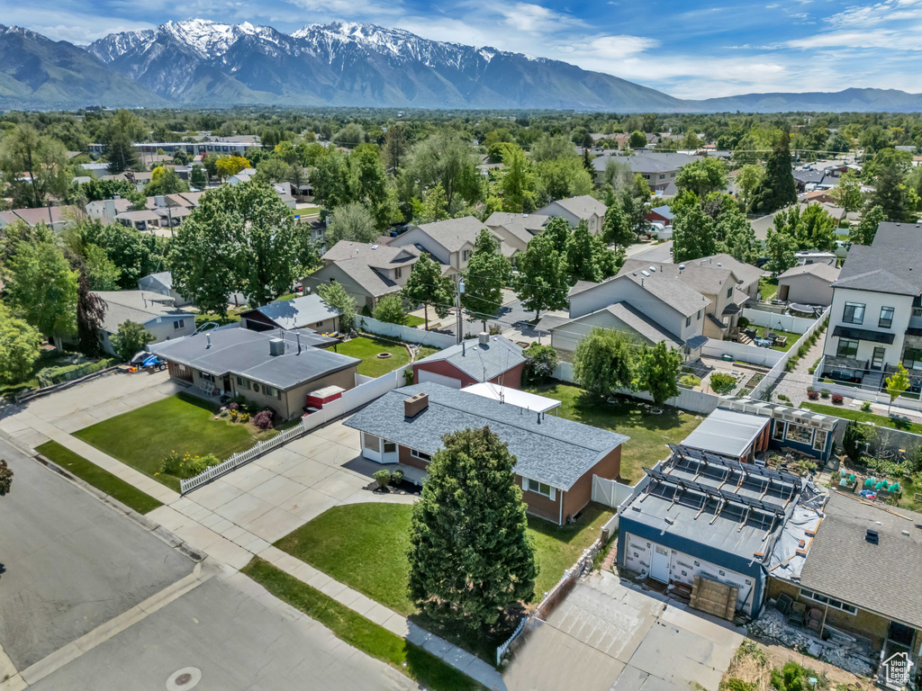 Aerial view of residential area featuring a mountainous background