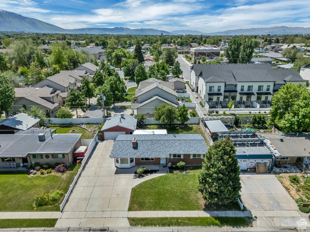 Aerial view of residential area featuring a mountain backdrop