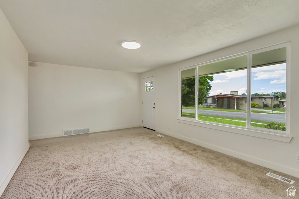 Unfurnished room with baseboards and carpet flooring