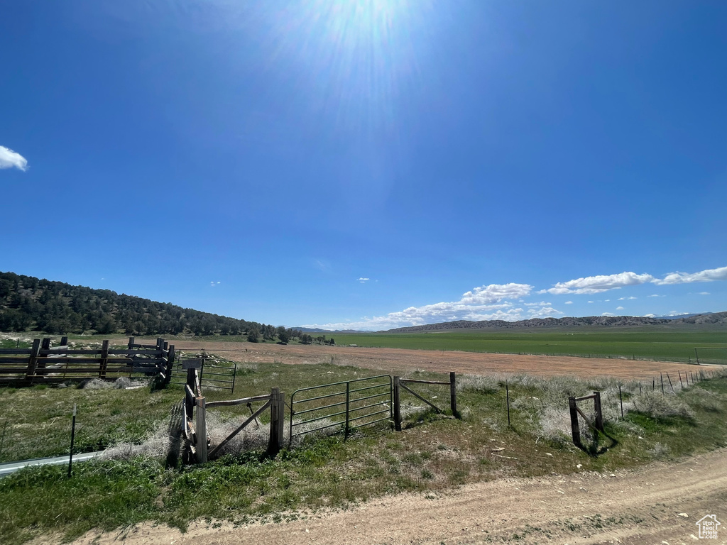 View of yard featuring a view of rural / pastoral area and fence