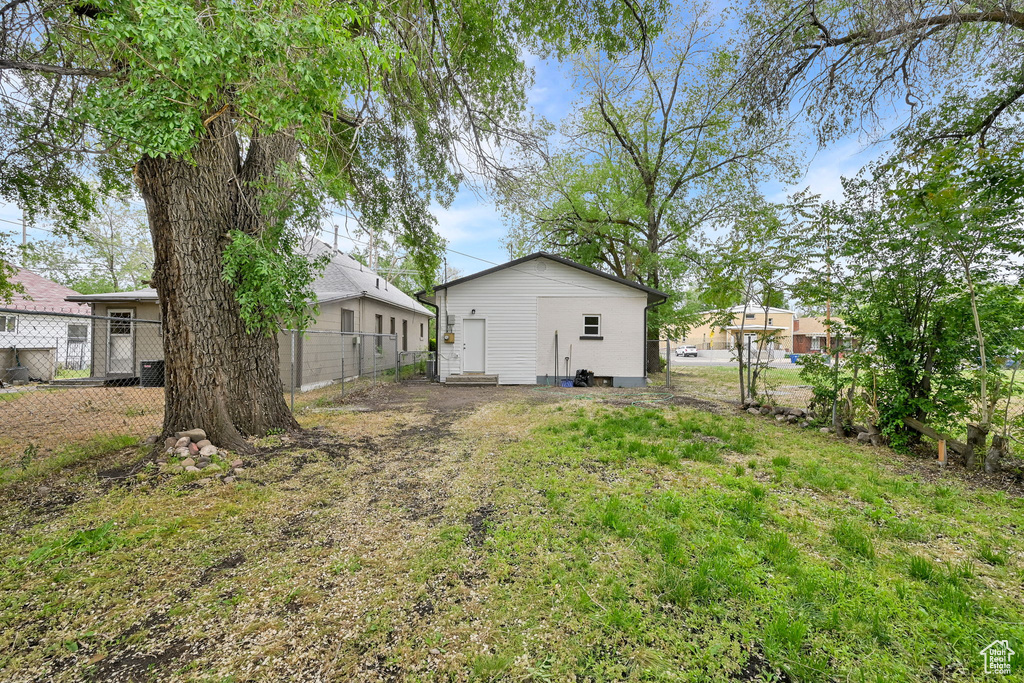 View of yard featuring fence