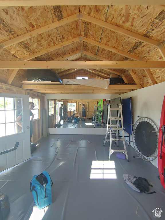 Sunroom / solarium featuring vaulted ceiling