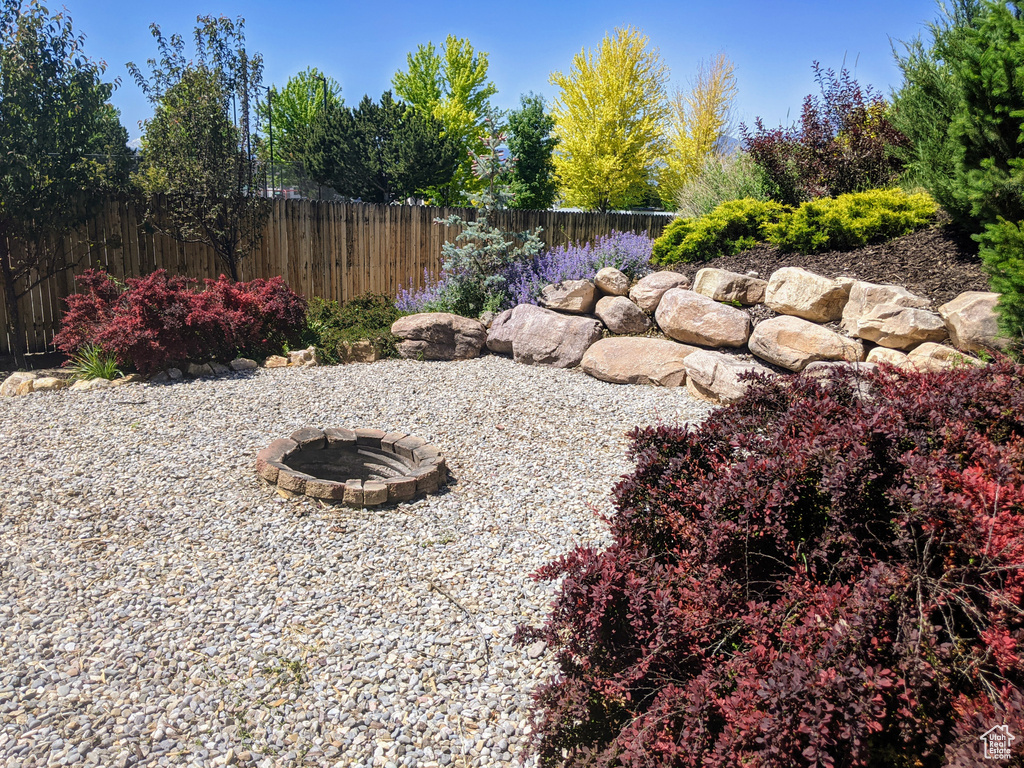 View of yard with a fire pit
