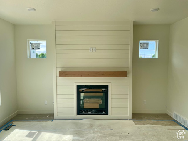 Detailed view of baseboards and a large fireplace