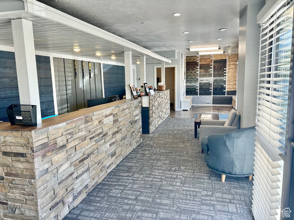 Reception area featuring a textured ceiling