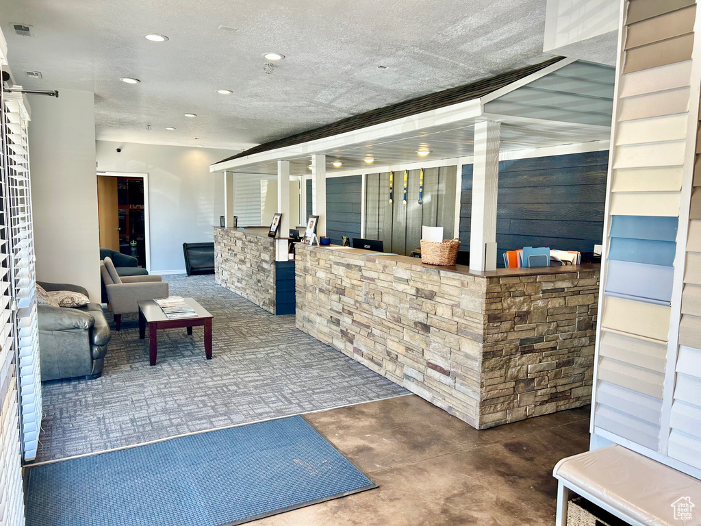 Reception featuring recessed lighting and a barn door