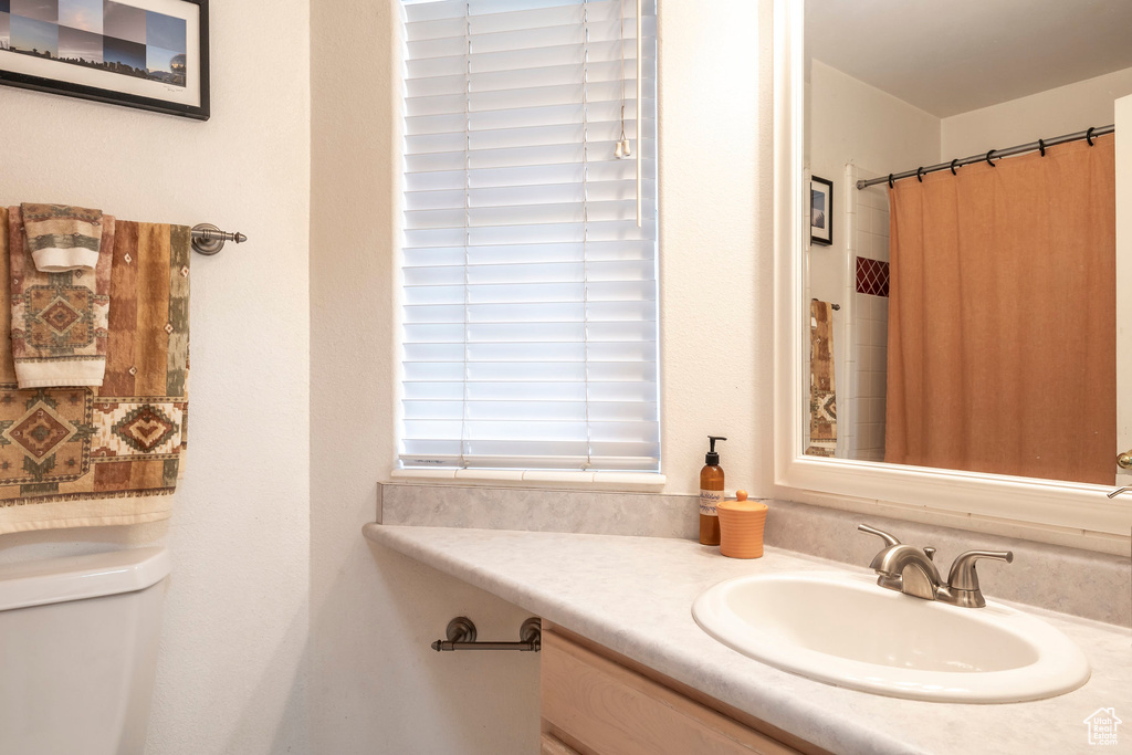 Full bath with vanity and toilet