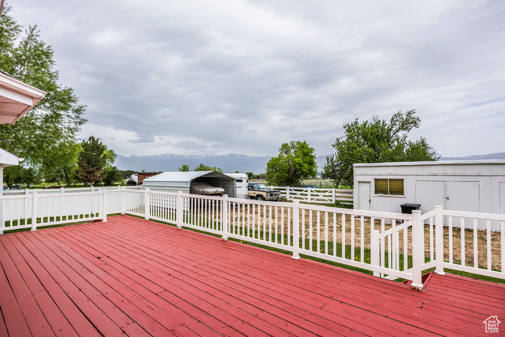 Wooden terrace with a carport