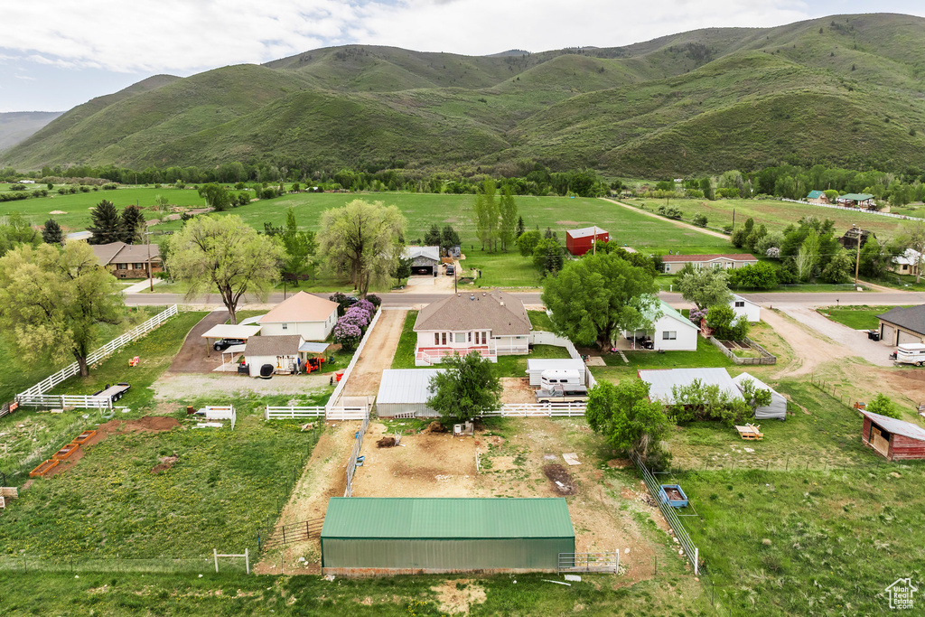 Aerial view of sparsely populated area featuring a mountain backdrop