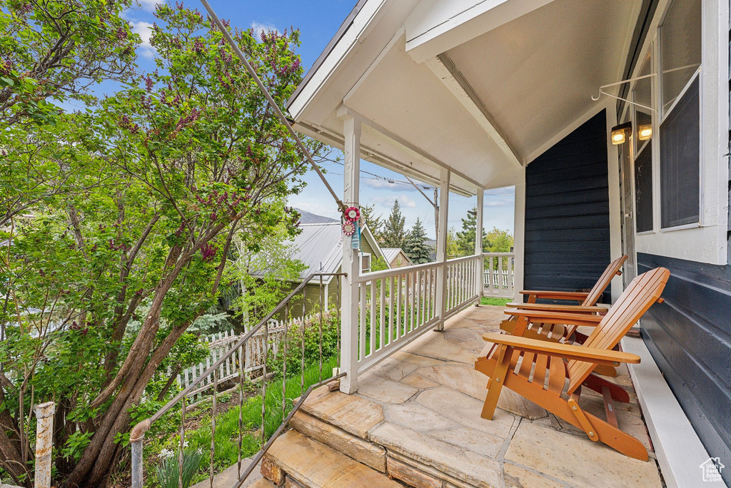 Wooden deck featuring covered porch