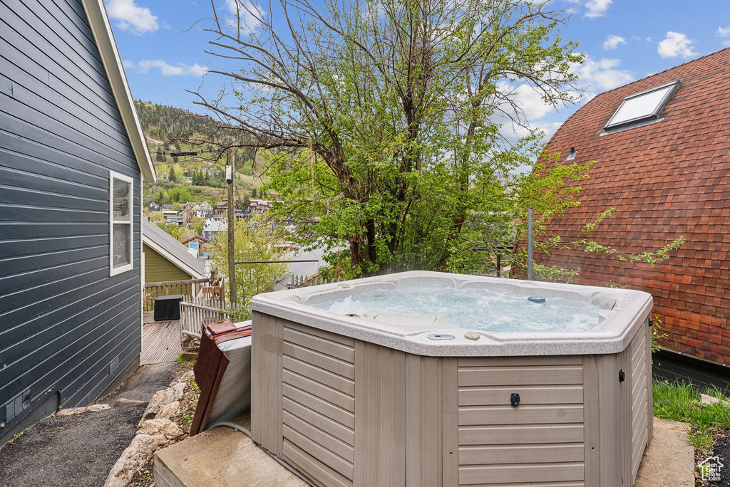 View of yard featuring a hot tub and central air condition unit