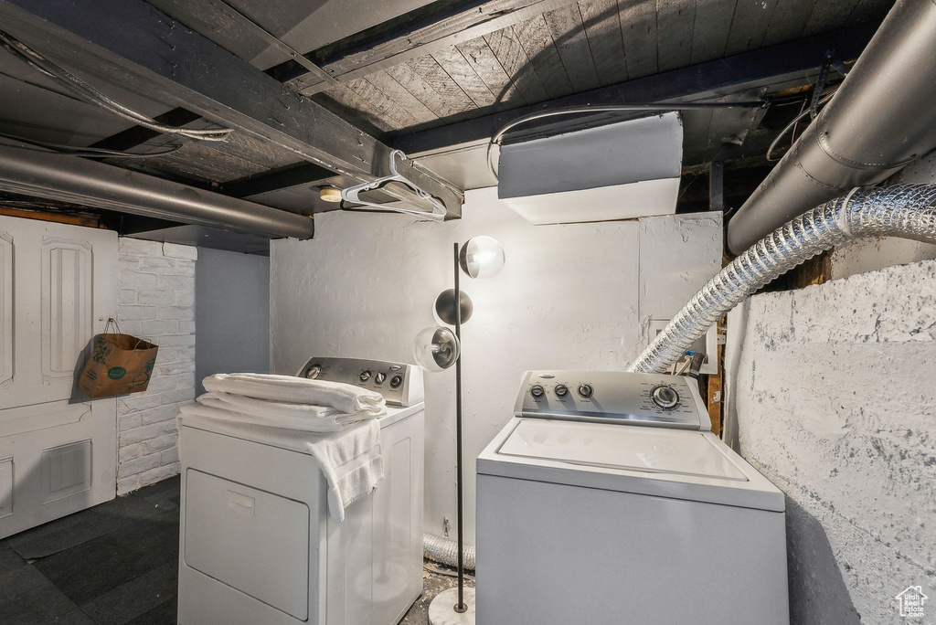 Laundry area with washer and clothes dryer