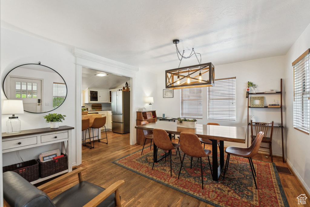 Dining space featuring wood finished floors