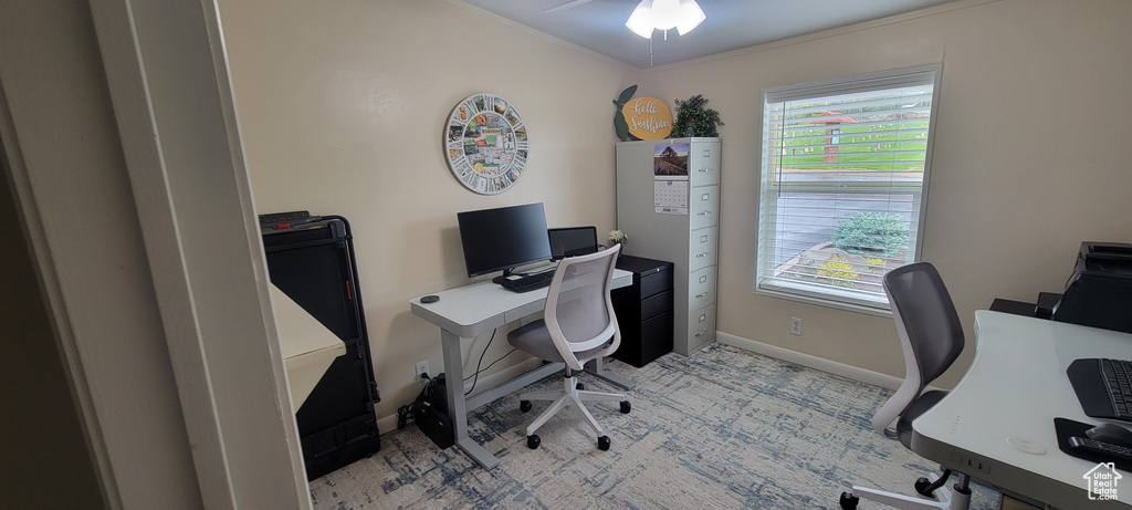 Office featuring a ceiling fan, baseboards, crown molding, and light colored carpet