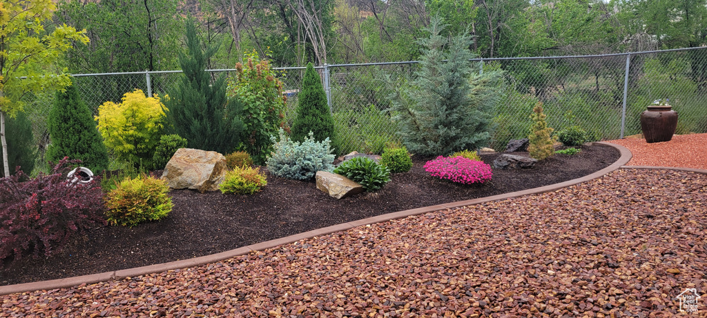 View of yard featuring fence