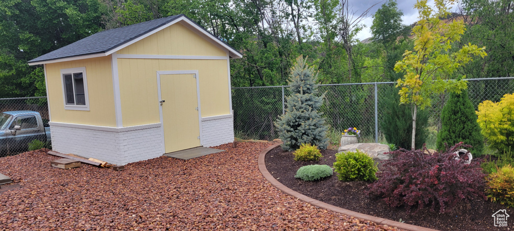 View of shed featuring a fenced backyard