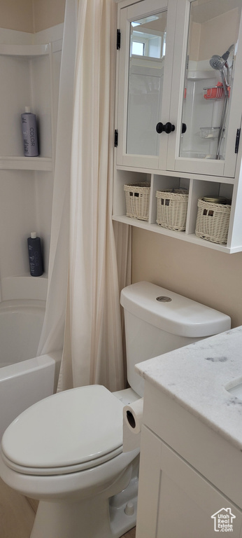 Full bath with toilet and vanity