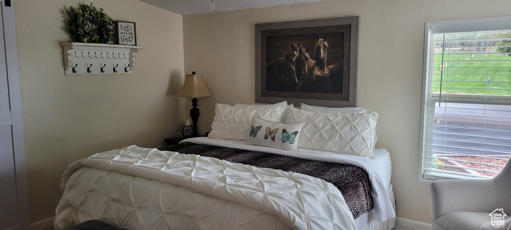 Bedroom featuring baseboards