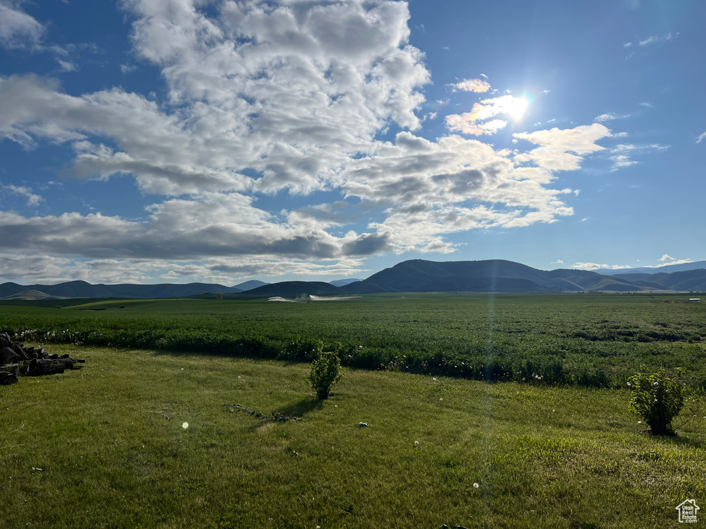 View of mountain backdrop with rural landscape