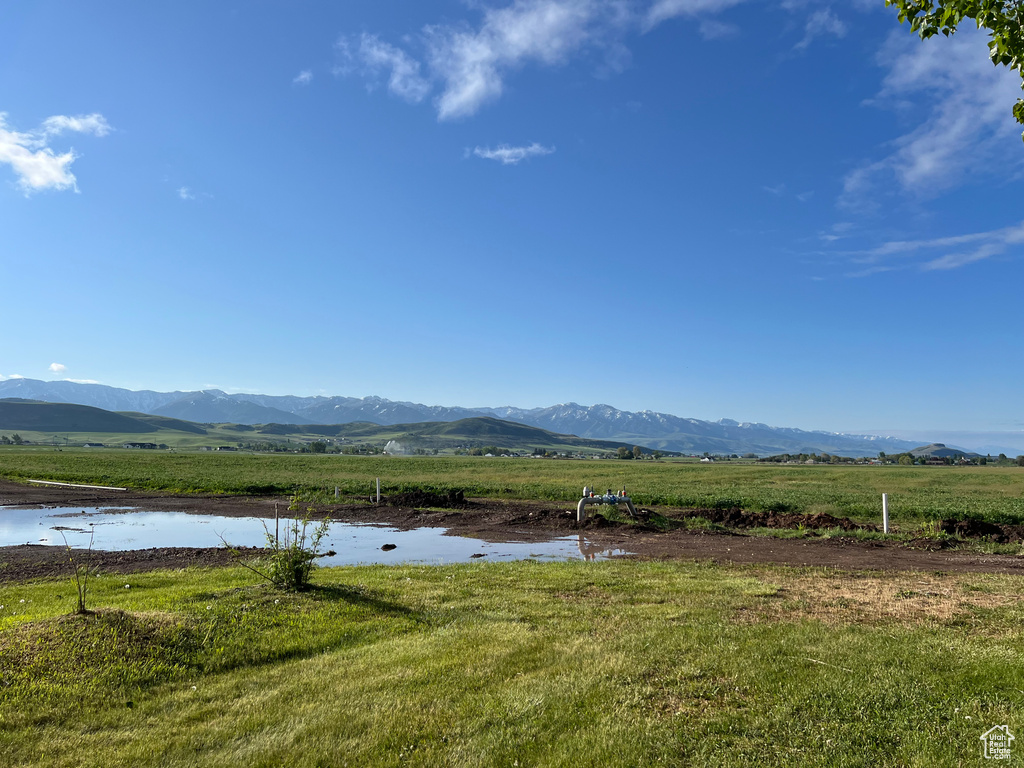 View of mountain background featuring rural landscape