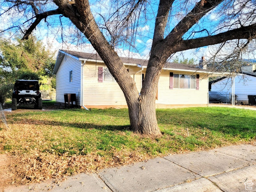 View of home's exterior featuring a lawn