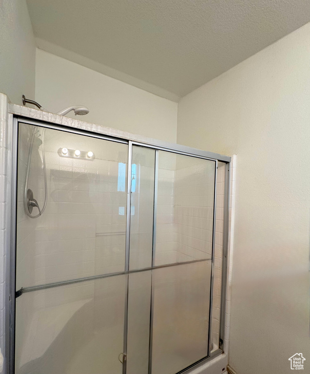 Full bath with a shower stall