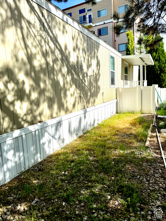 View of side of home with fence