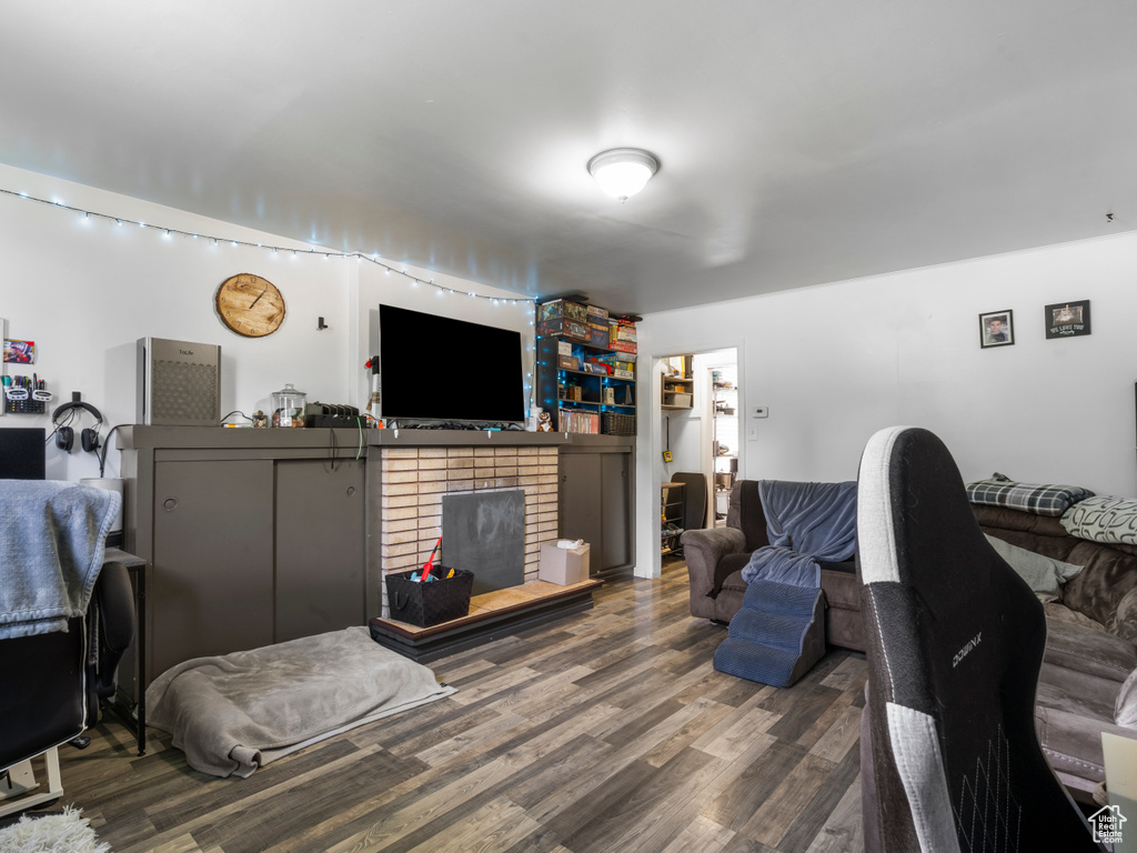 Living area with wood finished floors and a fireplace
