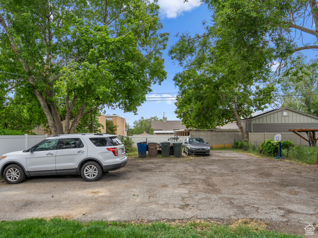 View of yard featuring fence