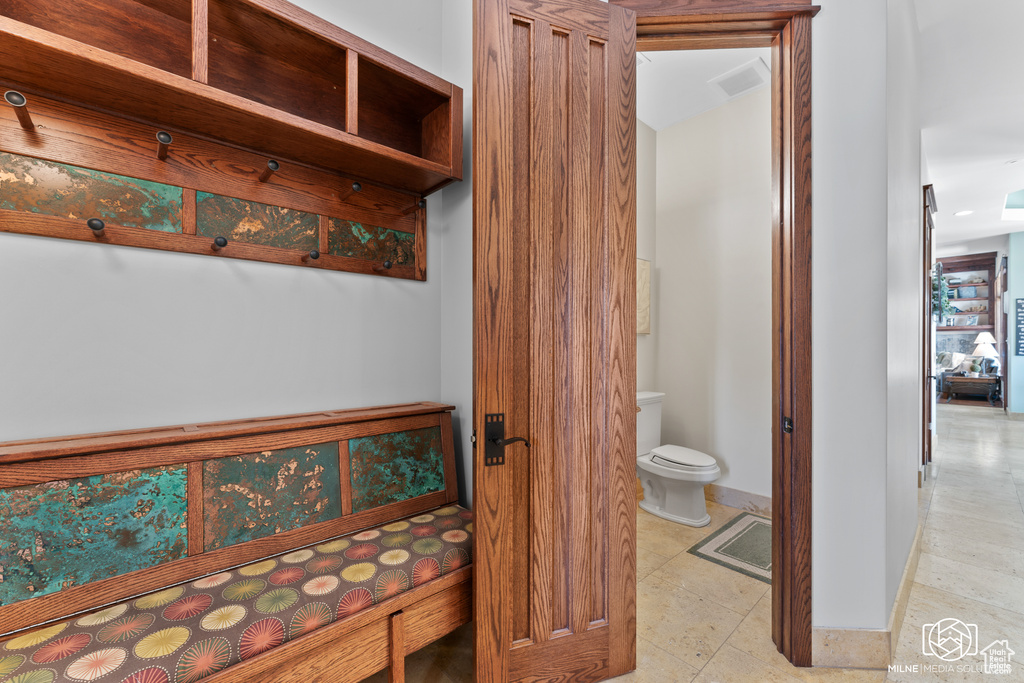 Bathroom with toilet and baseboards