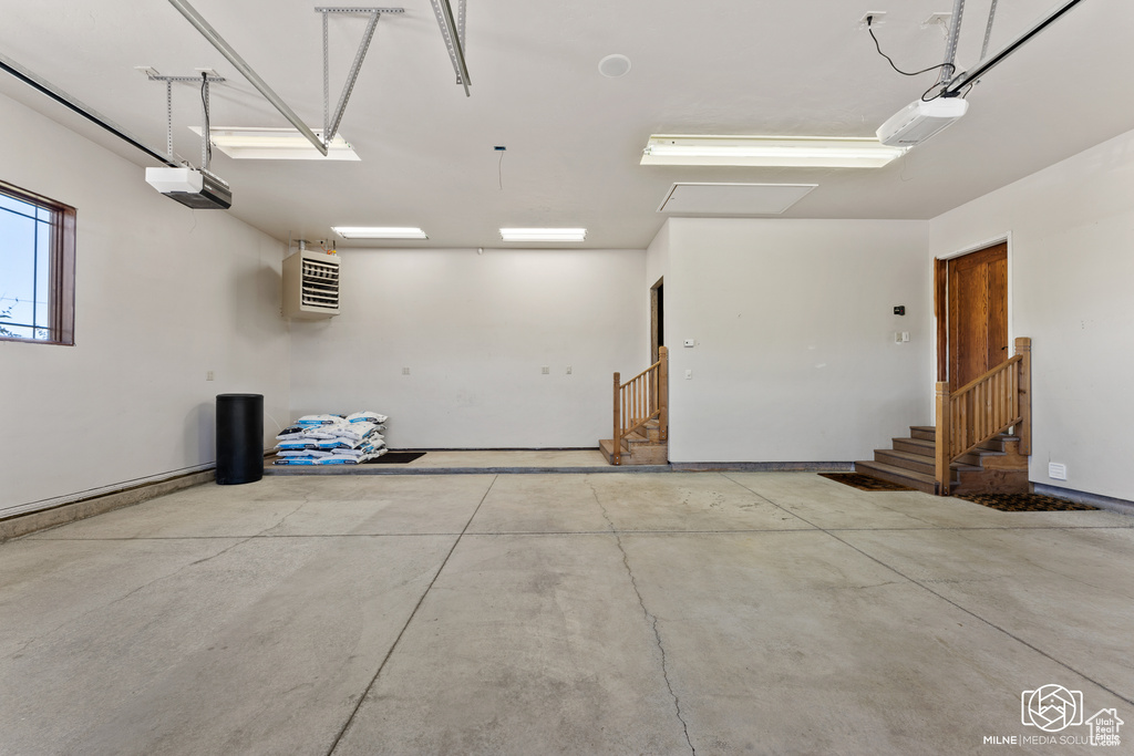Garage featuring a garage door opener
